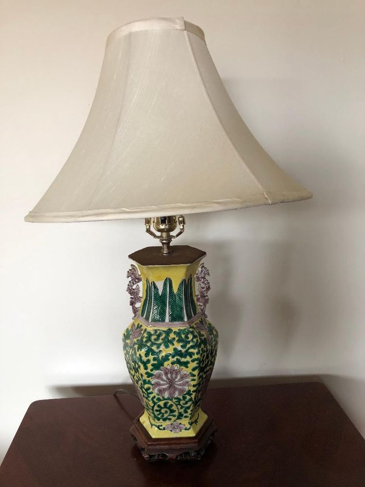 A vintage lamp that we repaired with a bell-shaped lampshade.